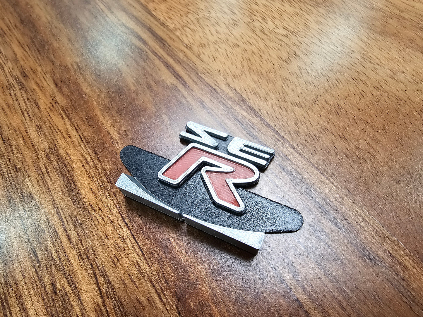 02-06 Sentra "SER" cluster emblem