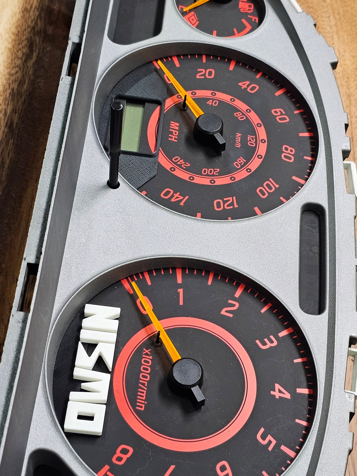 00-06 sentra "nismo" old logo rpm/tach emblem